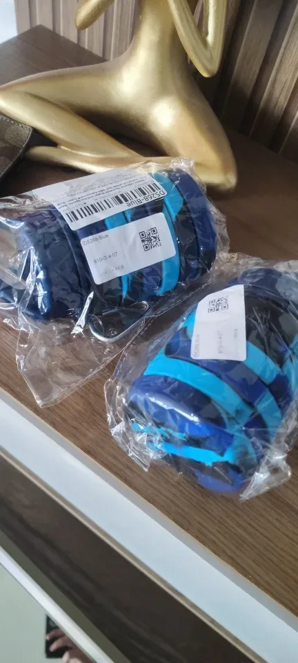 Collapsible water bottle folded compact next to its stainless steel cap — photo from a verified buyer